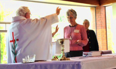 Fr Neil Vaney blesses Jane Langham at Marist Associate ceremony
